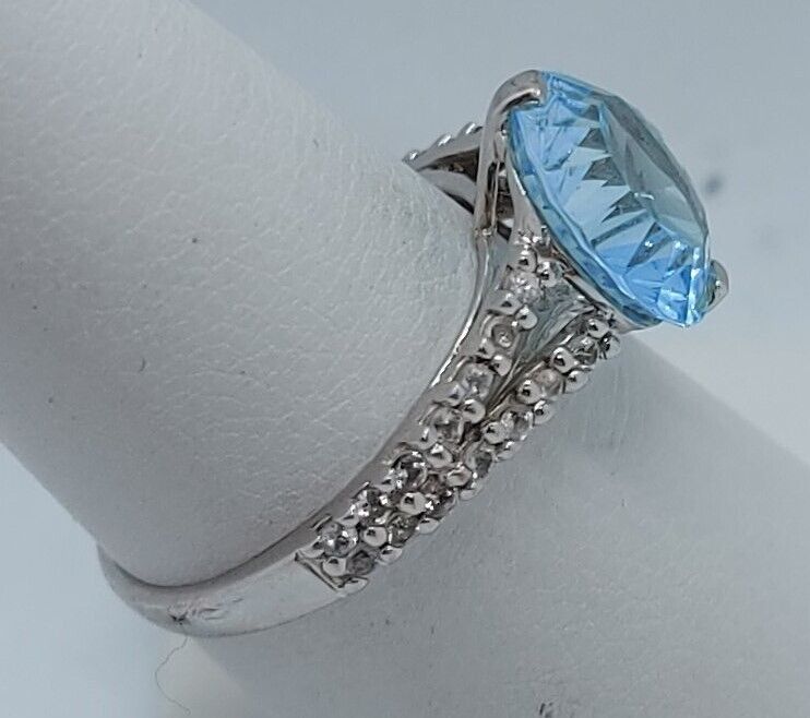 (N13604-3) 10K White Gold Ladies Ring 1 Blue Stone